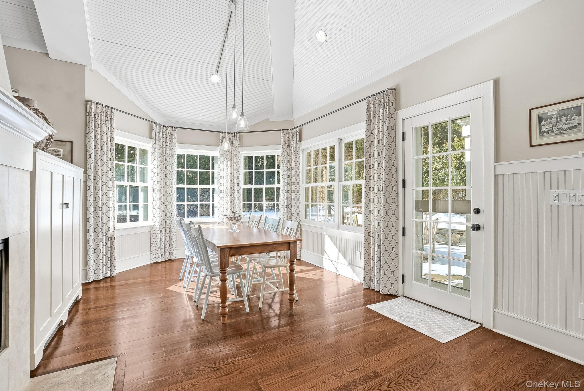 880 Forest Avenue Rye, NY 10580 - Photo 14 of 48 a view of a dining room with furniture wooden floor and chandelier