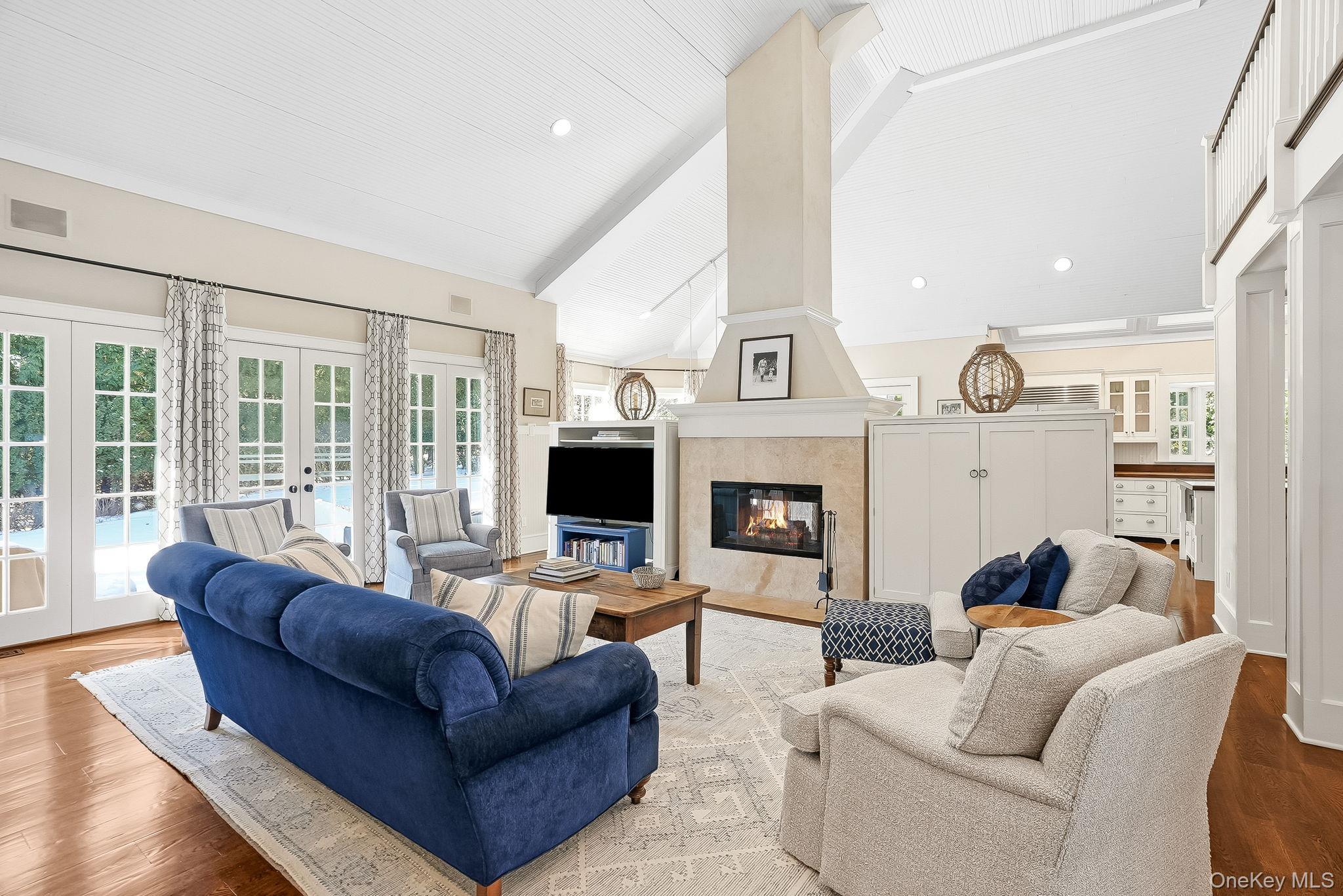 880 Forest Avenue Rye, NY 10580 - Photo 16 of 48 a living room with furniture and a fireplace