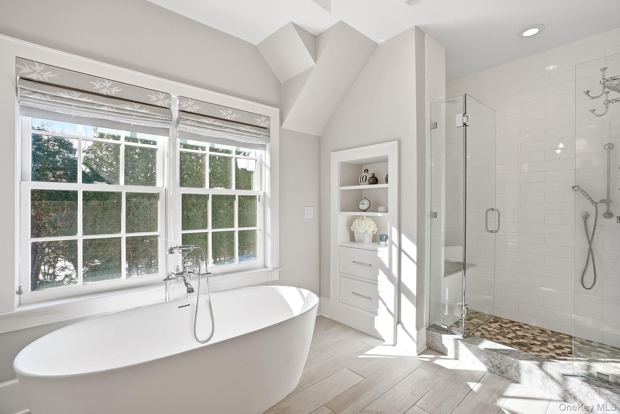 880 Forest Avenue Rye, NY 10580 - Photo 26 of 48 a bathroom with a granite countertop tub shower and a sink