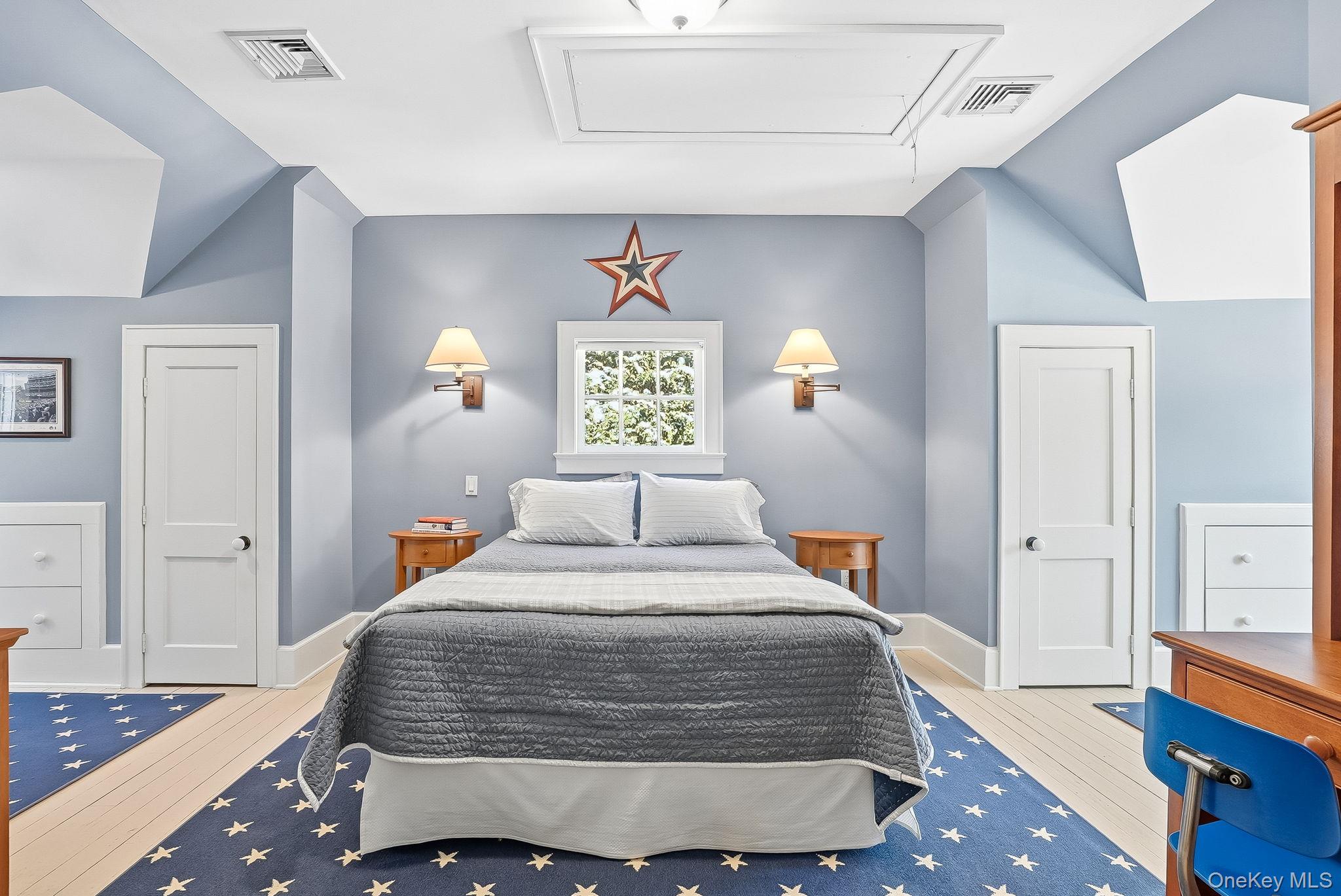 880 Forest Avenue Rye, NY 10580 - Photo 34 of 48 a bedroom with a bed and window