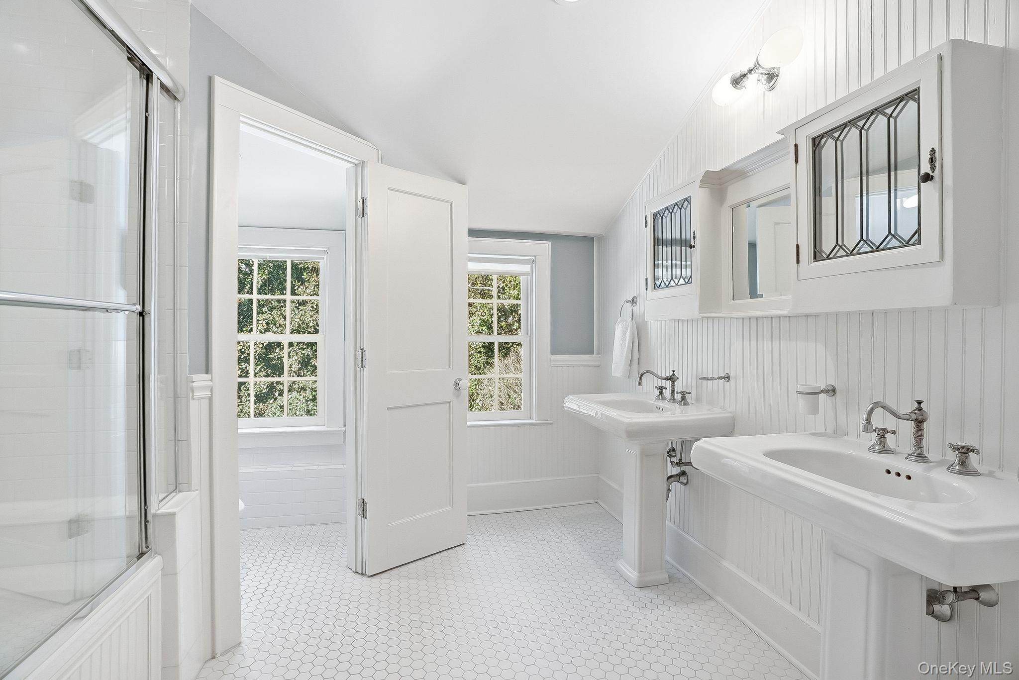 880 Forest Avenue Rye, NY 10580 - Photo 36 of 48 Well Appointed Hall Bathroom with Two Pedestal Sinks