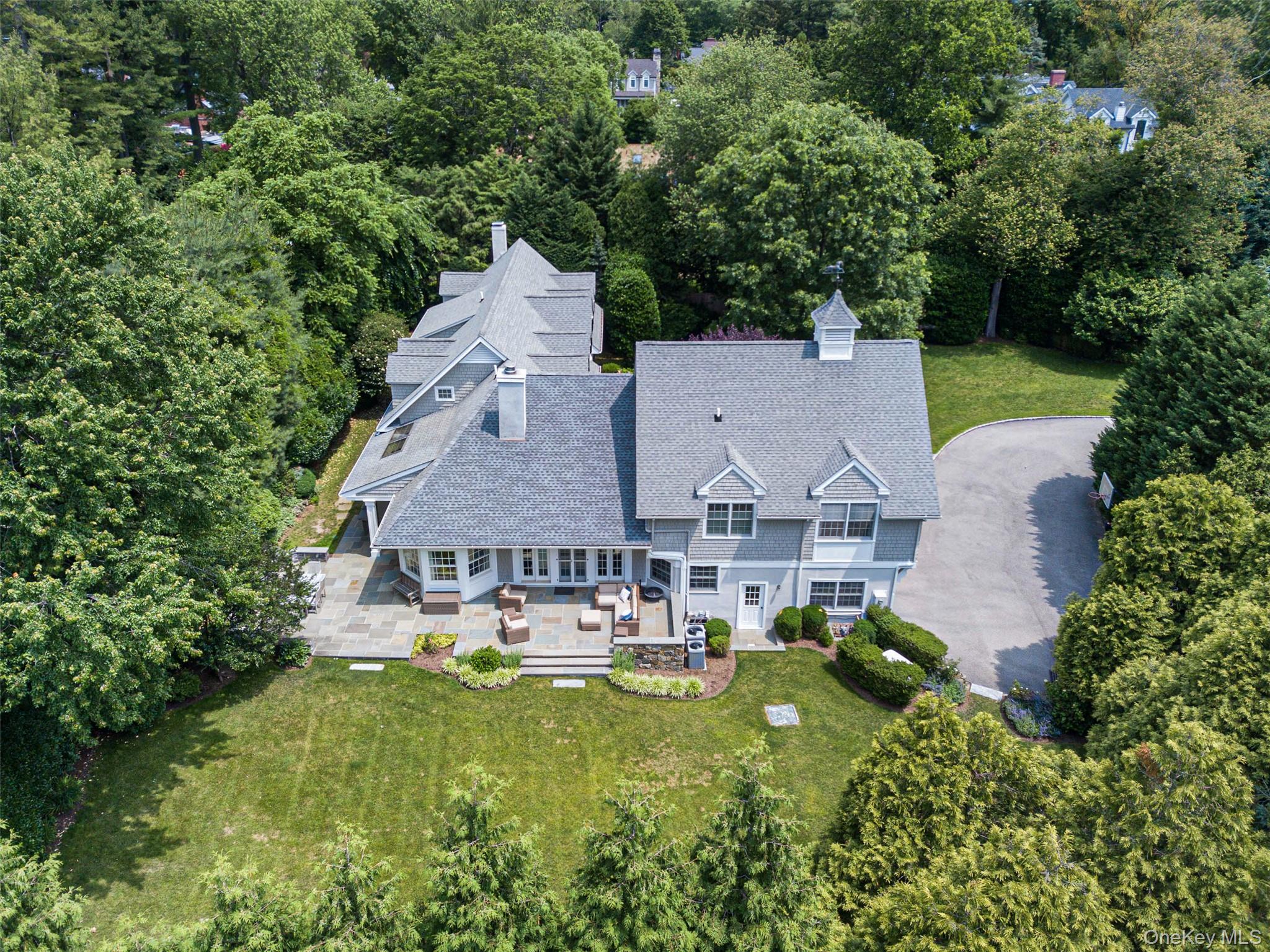 880 Forest Avenue Rye, NY 10580 - Photo 40 of 48 an aerial view of a house with yard swimming pool and outdoor seating
