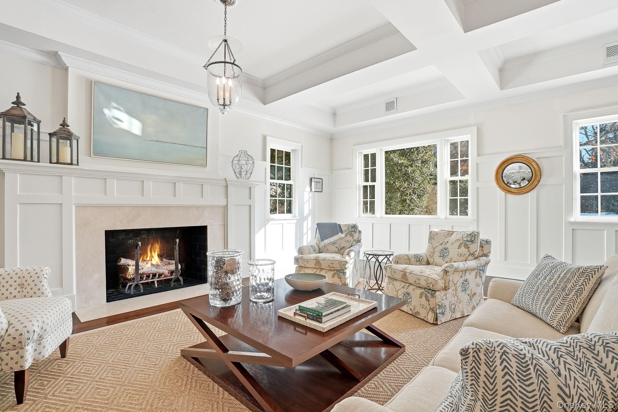 880 Forest Avenue Rye, NY 10580 - Photo 8 of 48 a living room with furniture a fireplace and a window
