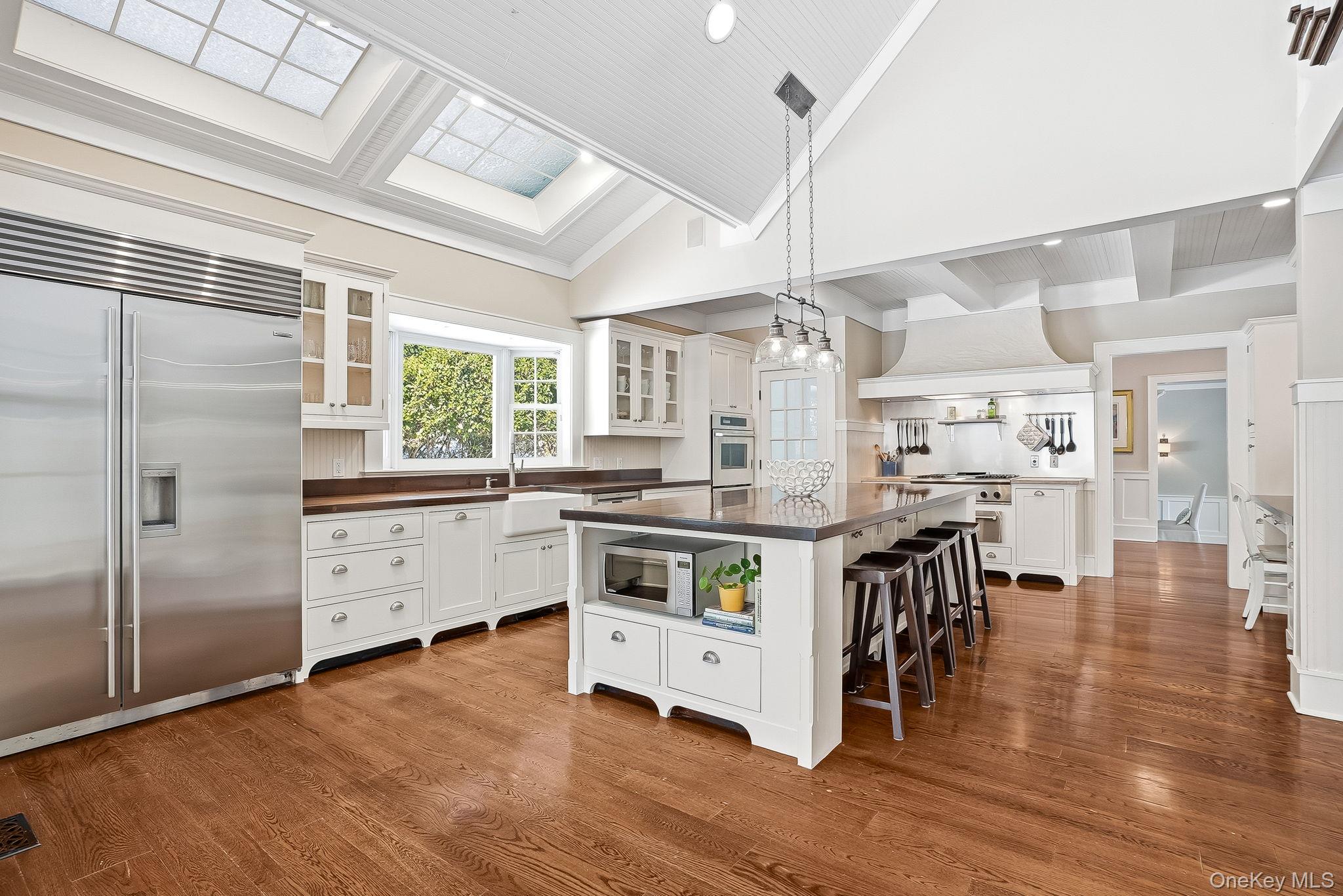 880 Forest Avenue Rye, NY 10580 - Photo 10 of 48 Chef's Kitchen with Vaulted Ceiling and Skylights