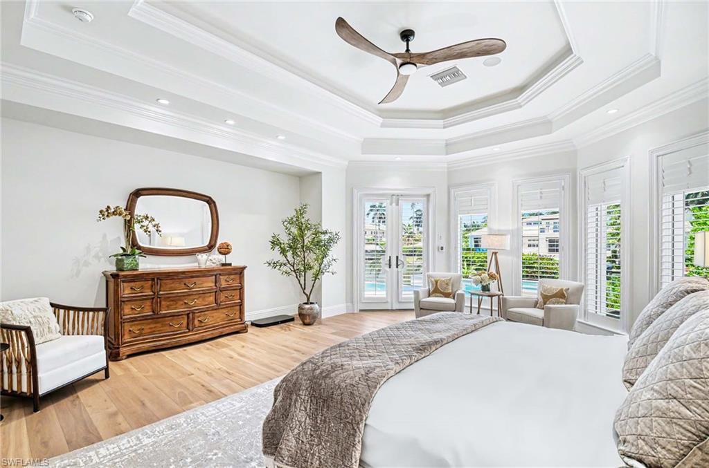 1888 6th Street South Naples, FL 34102 - Photo 21 of 37 a bedroom with a bed and furniture