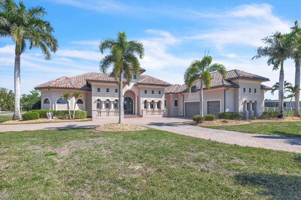 28959 Smugglers Lane Punta Gorda, FL 33982 - Photo 1 of 45 front view of a house with a yard