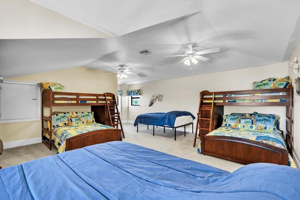 28959 Smugglers Lane Punta Gorda, FL 33982 - Photo 30 of 45 a bedroom with furniture and a wooden floor