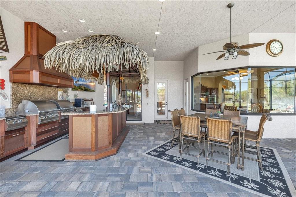 28959 Smugglers Lane Punta Gorda, FL 33982 - Photo 33 of 45 a dining room with a table tennis table and chairs