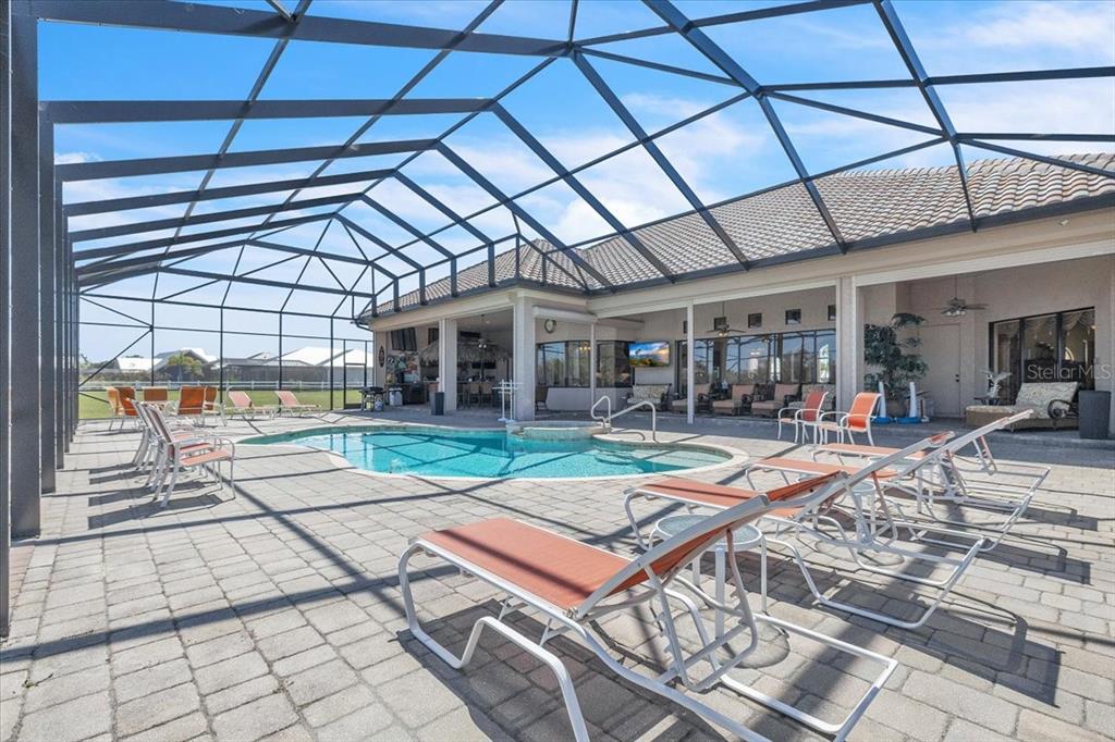 28959 Smugglers Lane Punta Gorda, FL 33982 - Photo 4 of 45 a view of a swimming pool with a patio