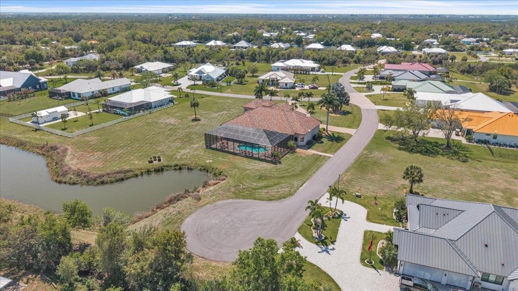 28959 Smugglers Lane Punta Gorda, FL 33982 - Photo 42 of 45 an aerial view of residential houses with outdoor space