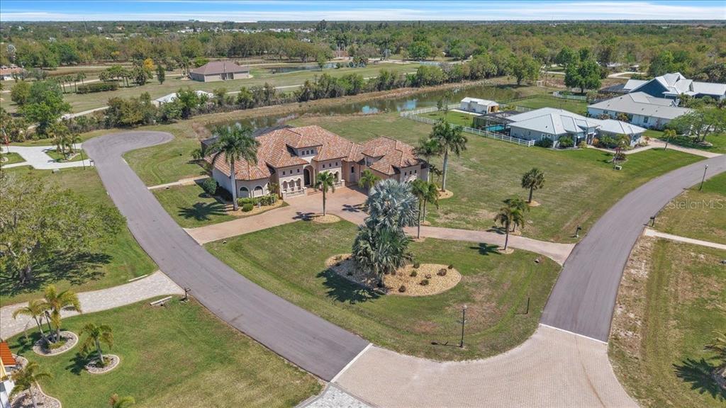 28959 Smugglers Lane Punta Gorda, FL 33982 - Photo 43 of 45 an aerial view of a house with a yard