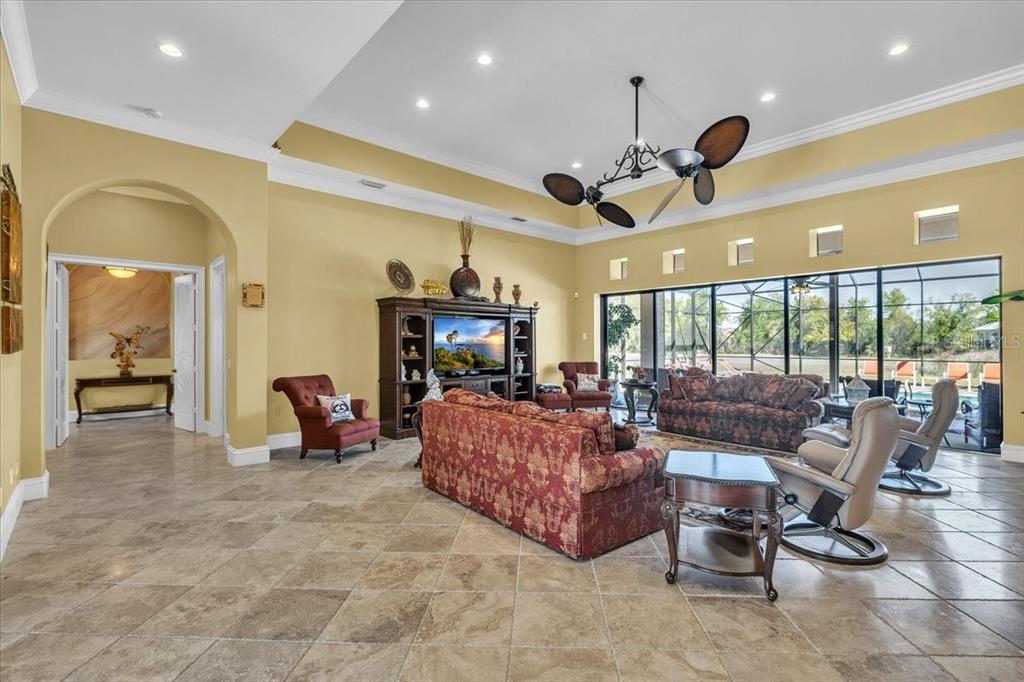 28959 Smugglers Lane Punta Gorda, FL 33982 - Photo 8 of 45 a living room with furniture gym equipment and a large window