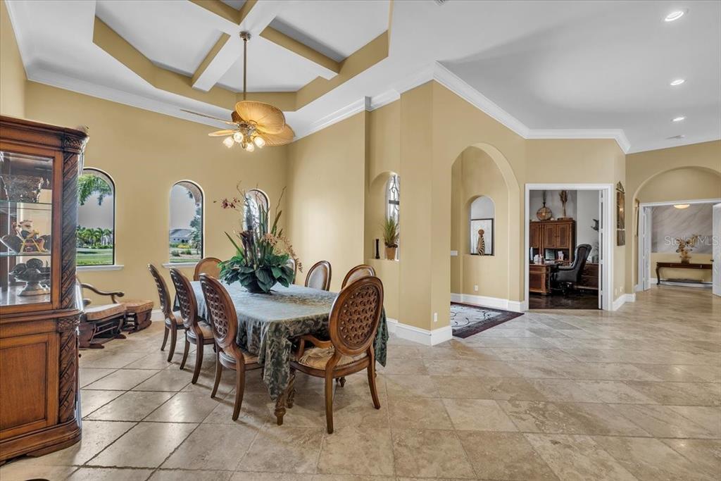 28959 Smugglers Lane Punta Gorda, FL 33982 - Photo 9 of 45 a view of a dining room with furniture and a chandelier