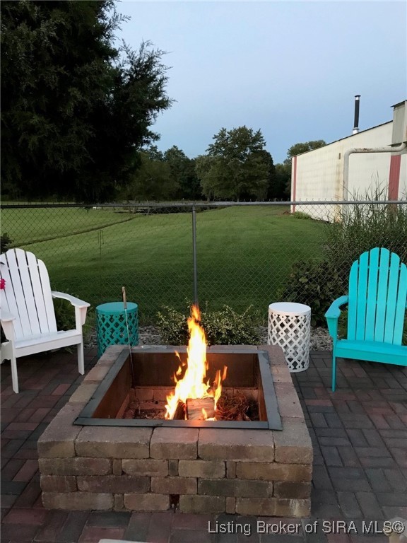 1127 Crone Road Memphis, IN 47143 - Photo 6 of 77 Fire pit sitting area inside pool fencing.
