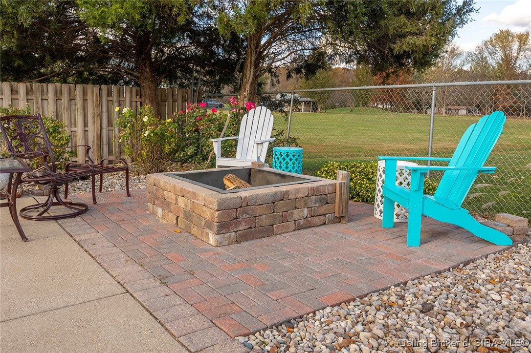 1127 Crone Road Memphis, IN 47143 - Photo 70 of 77 Adarondack pool chairs, side tables & fire pit rem