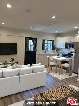 a view of a kitchen with a sink cabinets and a stove