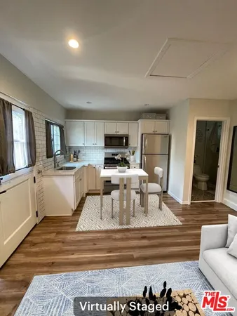 a kitchen with a refrigerator stove and sink