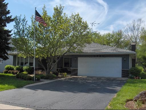 1735 West Wiesbrook Road Wheaton, IL 60189 - Photo 1 of 1 a front view of house with yard and trees