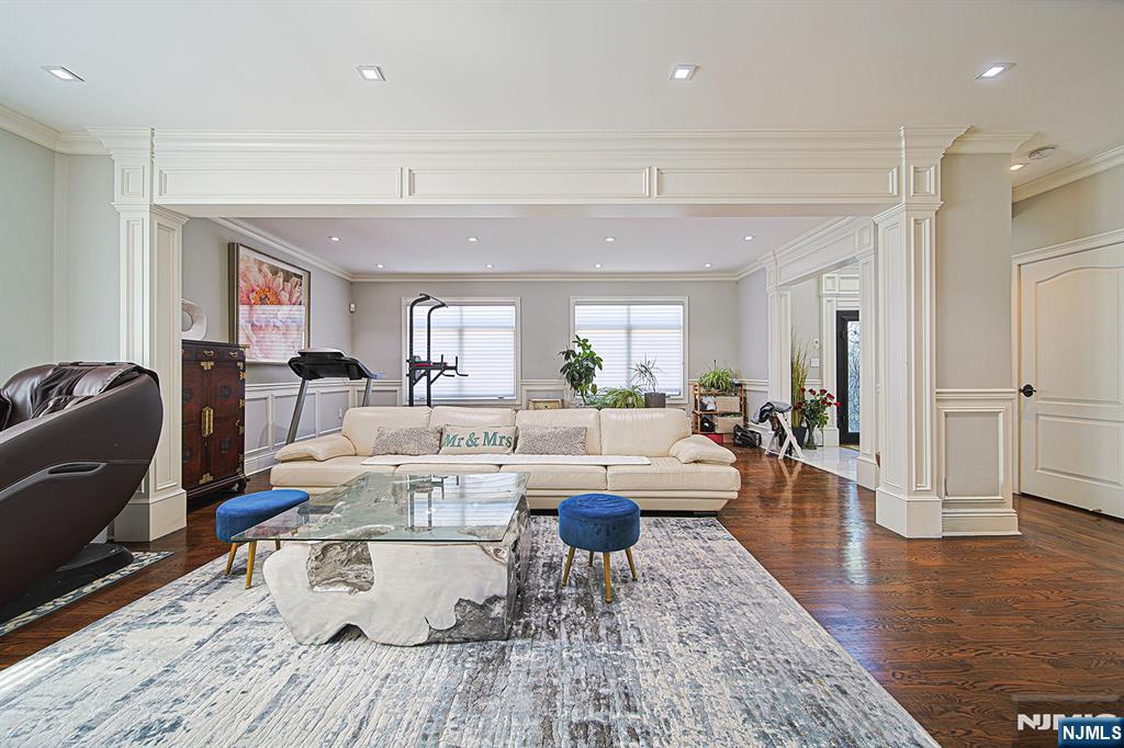 897 Virgil Avenue Ridgefield, NJ 07657 - Photo 12 of 50 a living room with furniture and a wooden floor