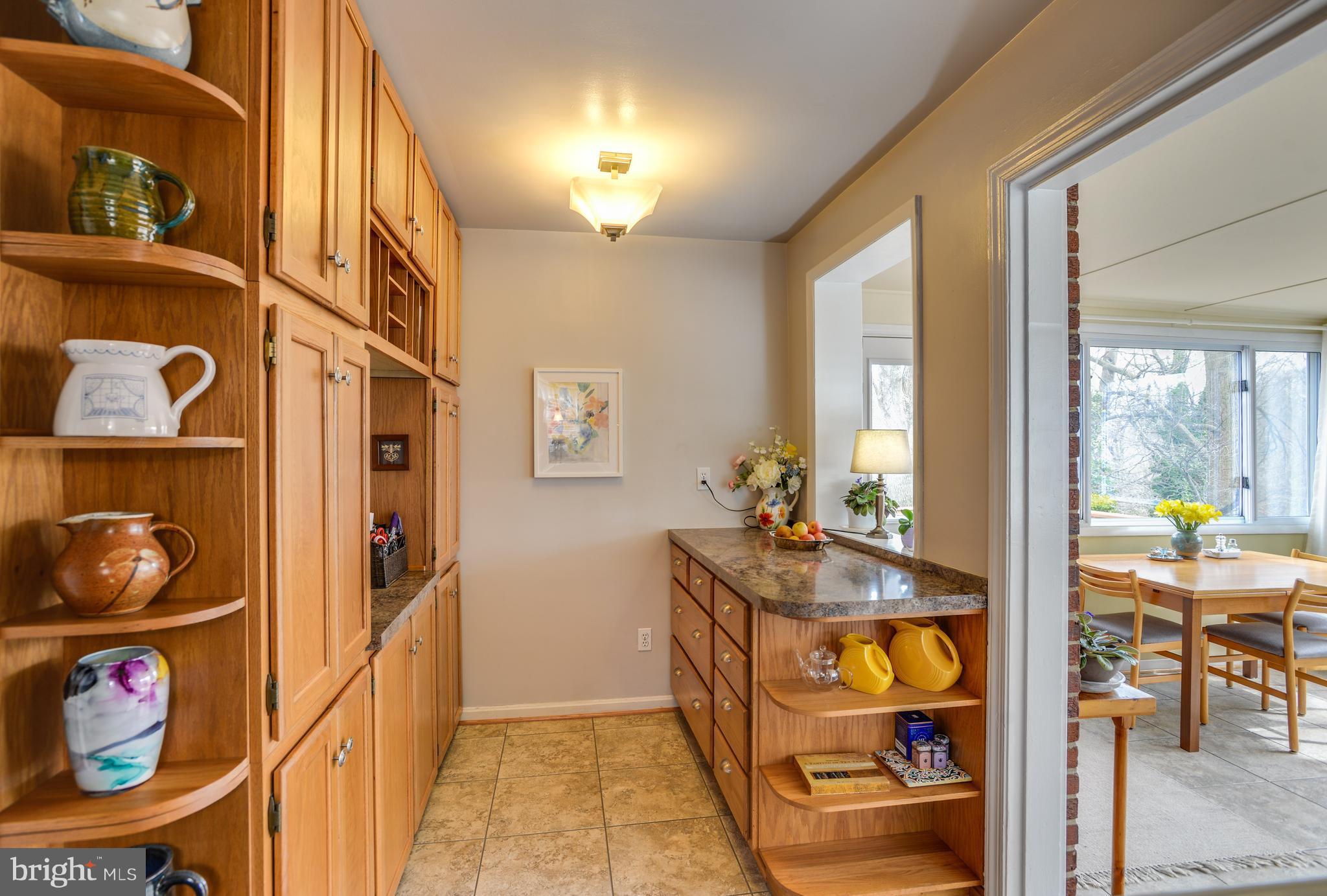 2406 Hayden Drive Silver Spring, MD 20902 - Photo 12 of 30 Wall of cabinets and extra counter with pass thru