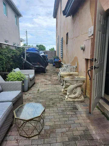 a kitchen with a sink appliances and cabinets
