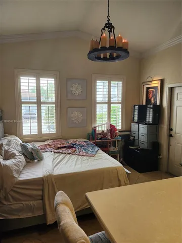 a bathroom with a sink a toilet a mirror and shower