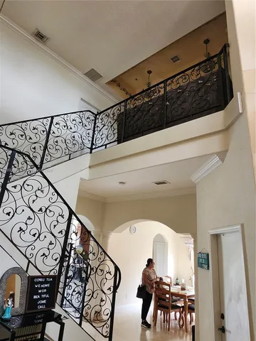 a kitchen with a refrigerator a stove a sink dishwasher with a dining table and chairs