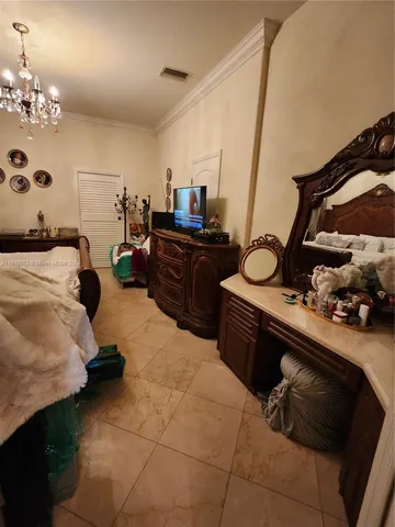 a kitchen with refrigerator and cabinets