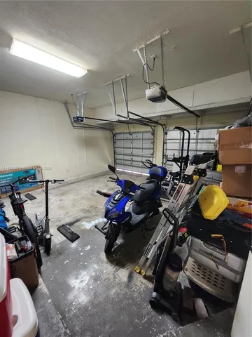a kitchen with a refrigerator and a sink