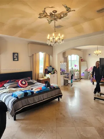 a bathroom with a bathtub sink and mirror