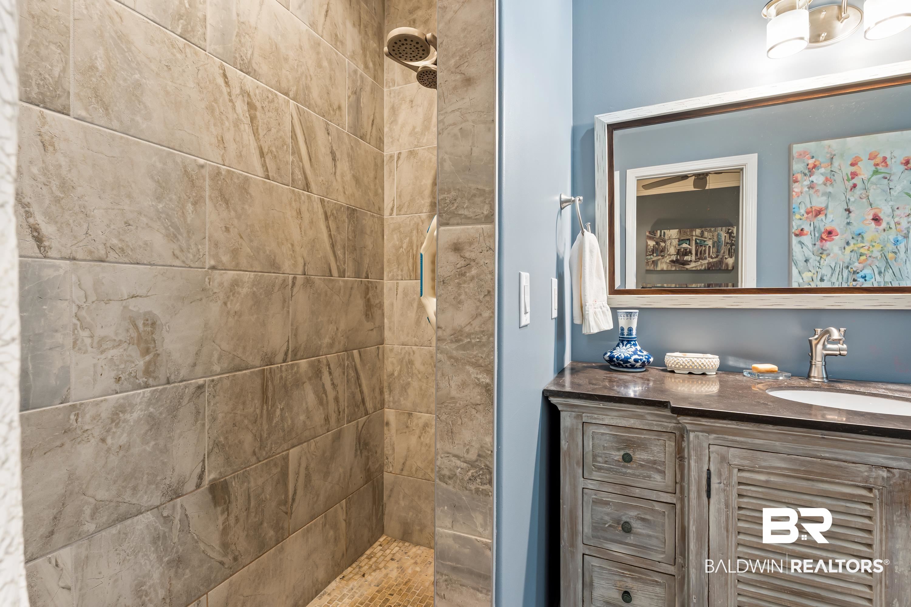 1113 Yellow Daisy Lane Foley, AL 36535 - Photo 18 of 35 Bathroom with tiled shower and vanity
