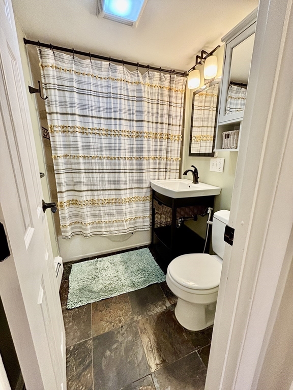 2192 Massachusetts Avenue, Unit 14 Cambridge, MA 02140 - Photo 14 of 19 a bathroom with a sink toilet and shower