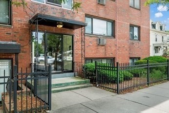 2192 Massachusetts Avenue, Unit 14 Cambridge, MA 02140 - Photo 2 of 19 a front view of a house with a small garden