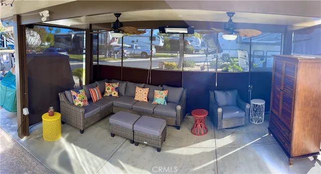 a outdoor living space with patio furniture and a potted plant