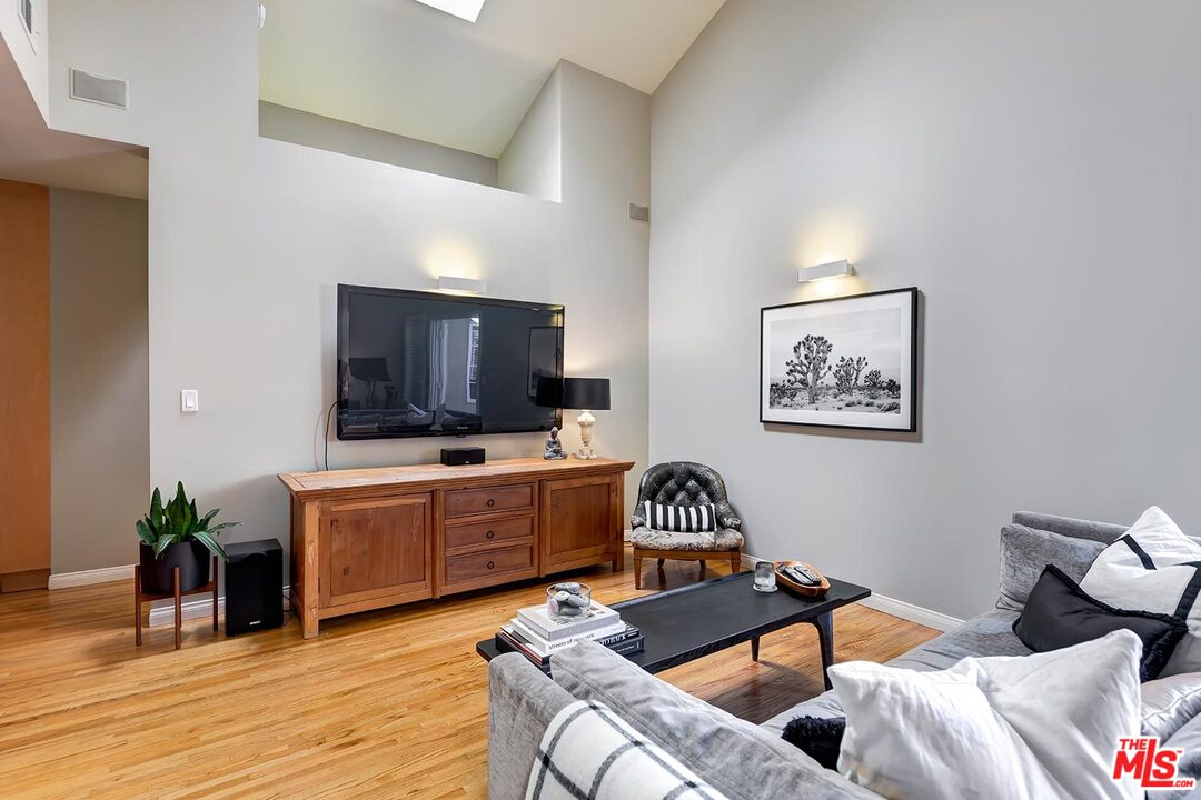 10629 Rountree Road Los Angeles, CA 90064 - Photo 17 of 37 a living room with furniture and a flat screen tv