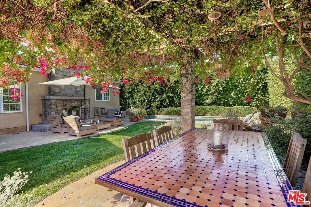10629 Rountree Road Los Angeles, CA 90064 - Photo 33 of 37 a view of a chair and table on the garden