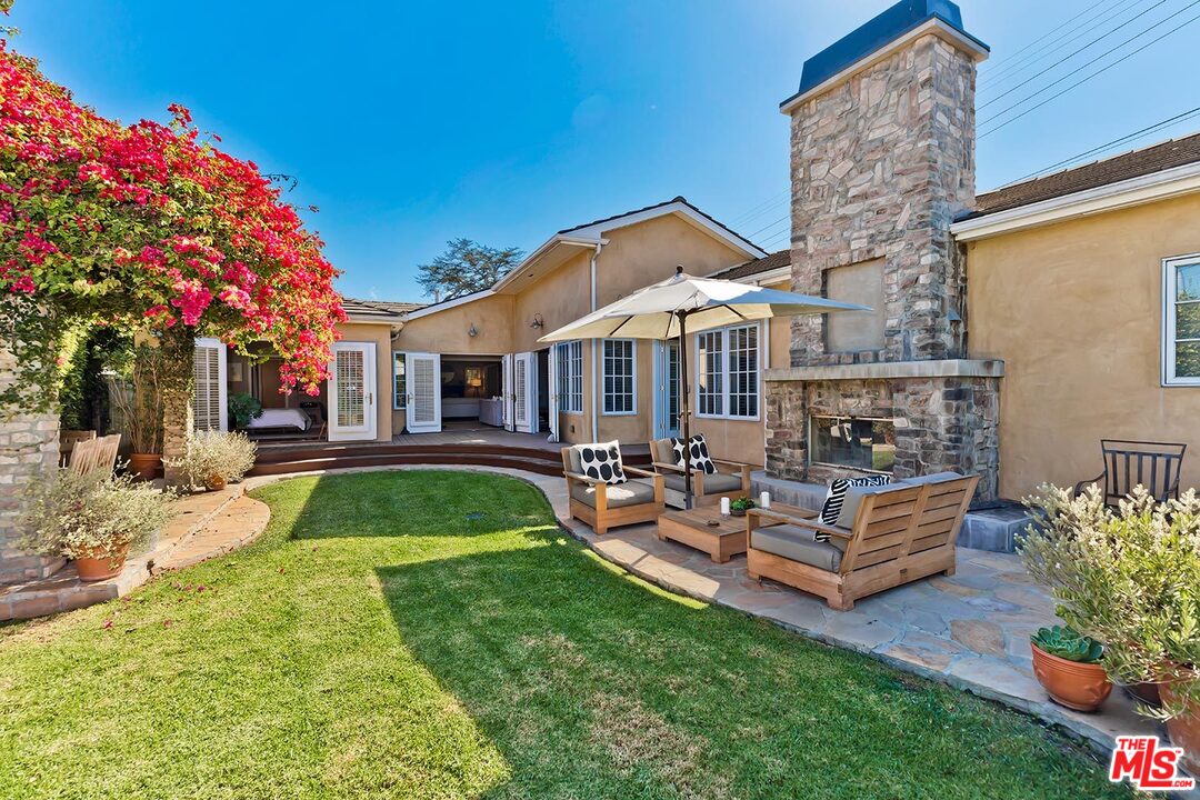 10629 Rountree Road Los Angeles, CA 90064 - Photo 34 of 37 a view of backyard of house with outdoor seating and green space