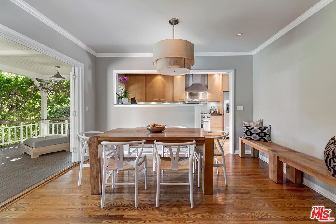 10629 Rountree Road Los Angeles, CA 90064 - Photo 9 of 37 a view of a dining room with furniture window and wooden floor