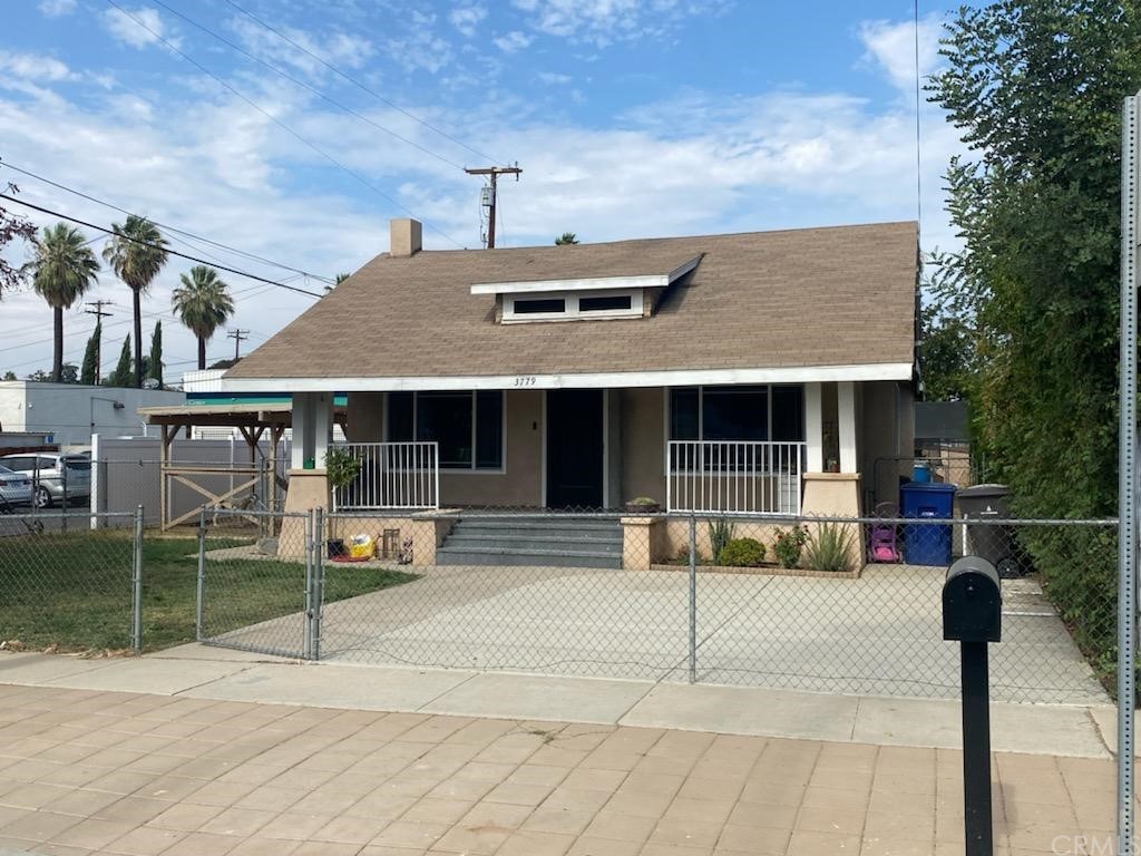 3779 Farnham Place Riverside, CA 92503 - Photo 1 of 1 a front view of a house with a garden and plants