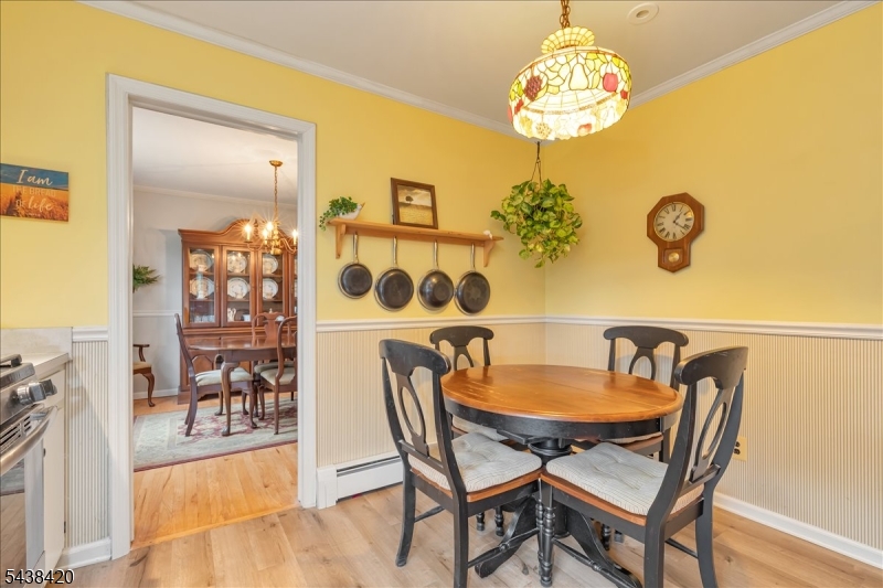 79 Main Street Califon, NJ 07830 - Photo 16 of 50 a view of a dining room with furniture and chandelier