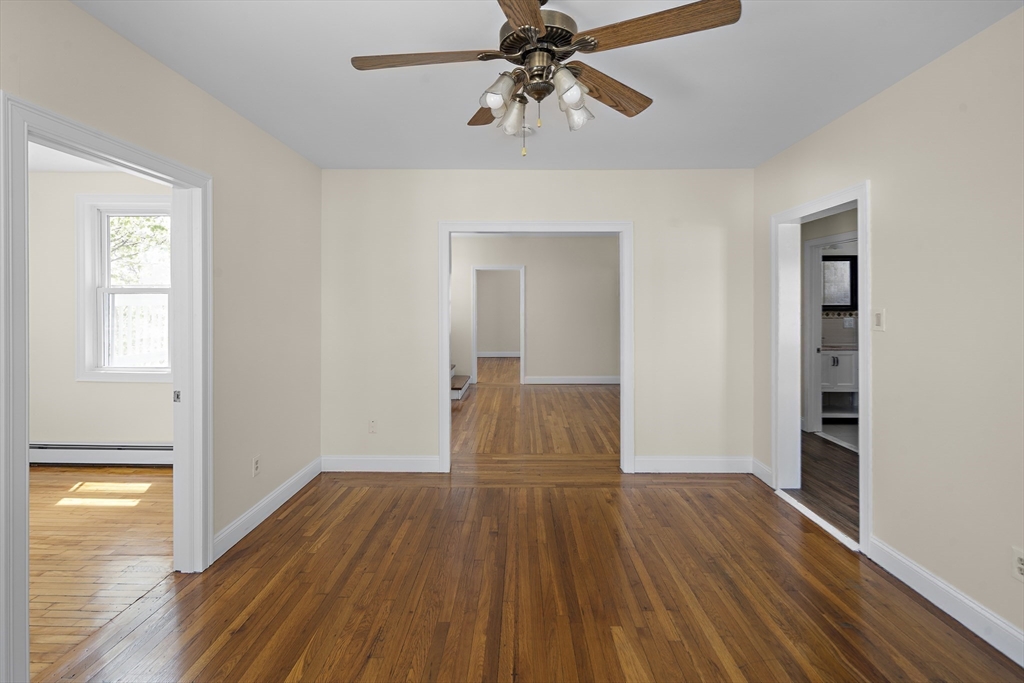 37 Union Street, Unit 2 Everett, MA 02149 - Photo 4 of 15 a view of a room with wooden floor closet and windows