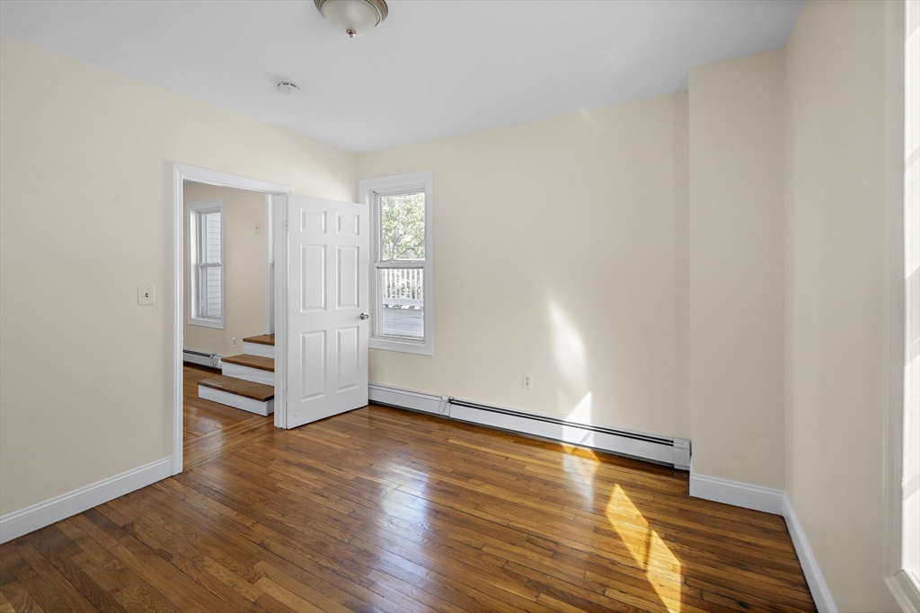 37 Union Street, Unit 2 Everett, MA 02149 - Photo 8 of 15 a view of empty room with wooden floor and fan