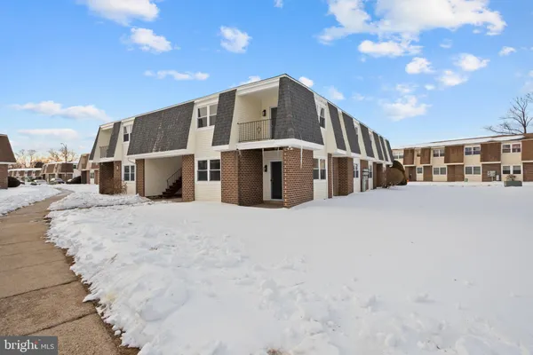 a view of a house with a snow in a yard