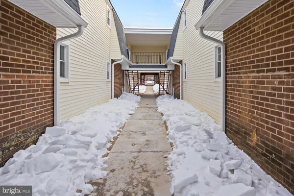 a view of a pathway with a patio