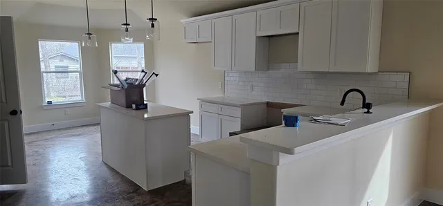 a view of a hallway with seating area