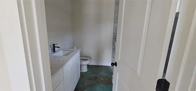 a bathroom with a sink a toilet and a shower