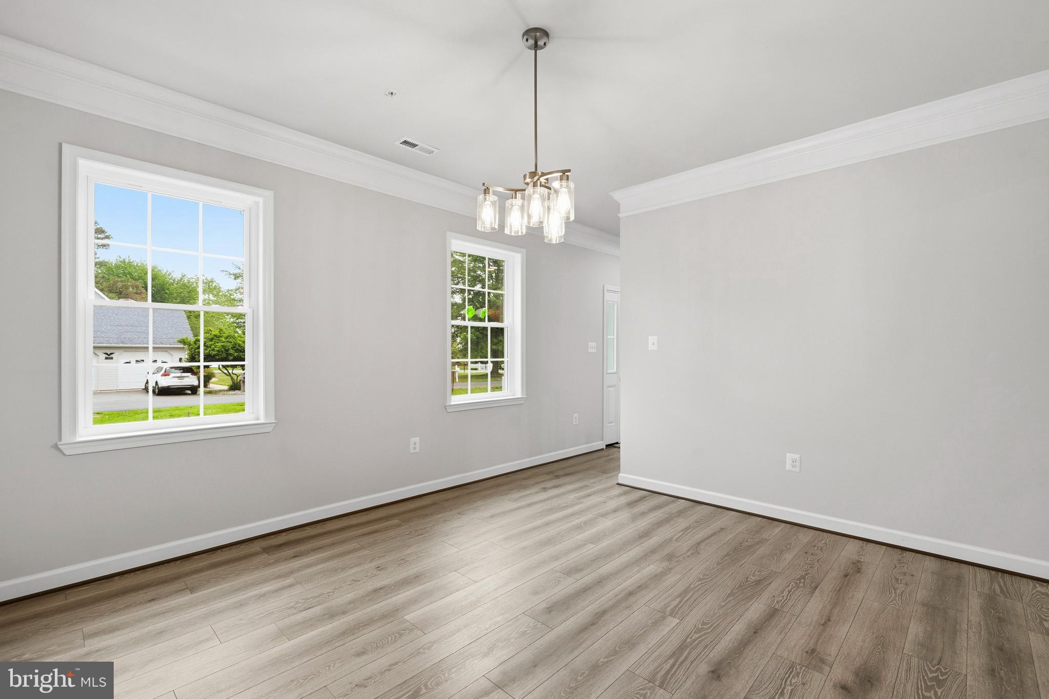 29725 Bruce Road Mechanicsville, MD 20659 - Photo 40 of 79 an empty room with wooden floor and windows