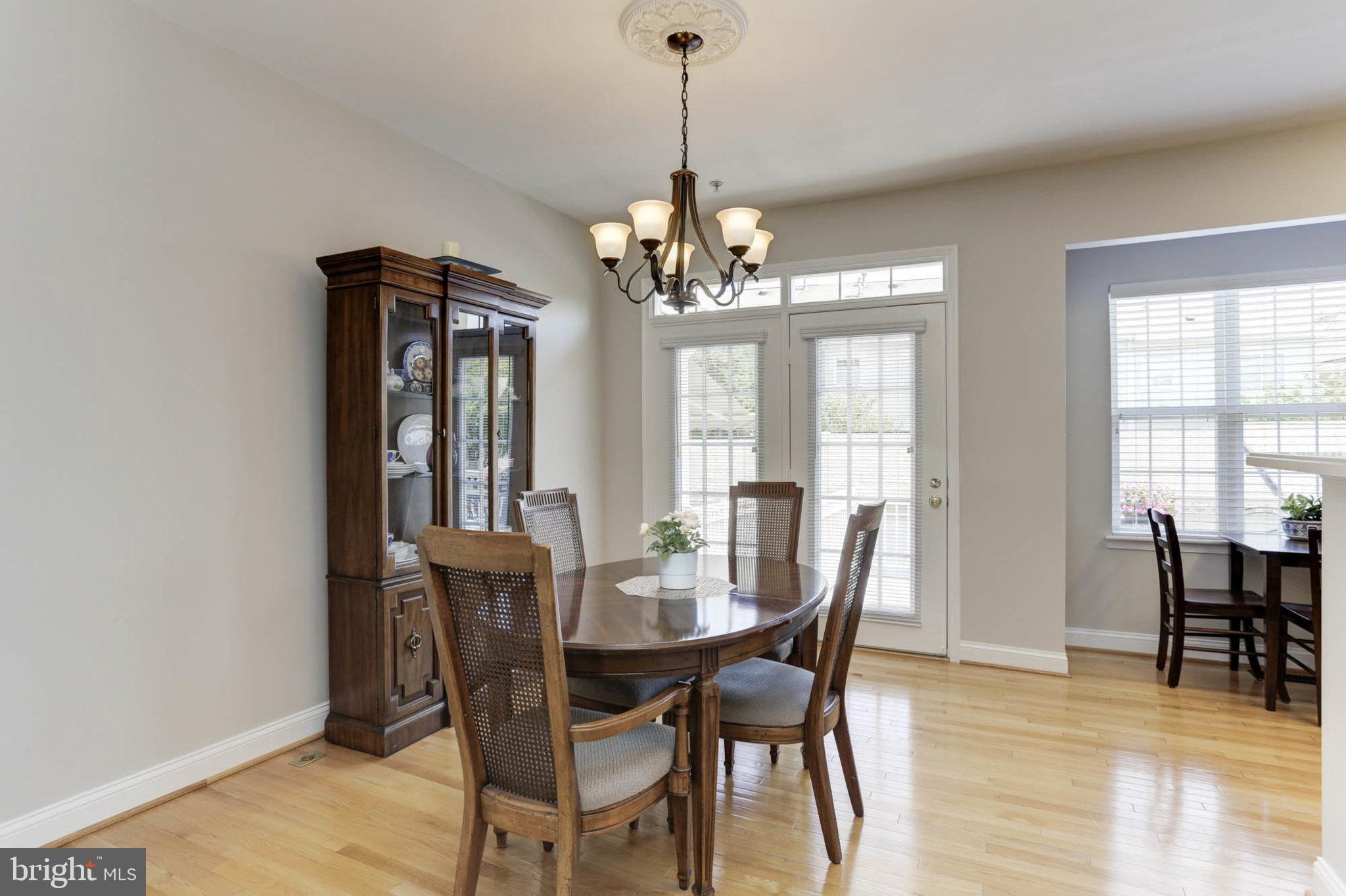 1027 Gaither Road Rockville, MD 20850 - Photo 11 of 71 Main Level - Dining Room and French Doors to Deck