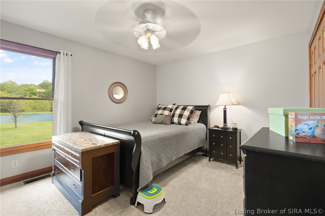 700 South 1233rd West Lexington, IN 47138 - Photo 16 of 65 Third bedroom with ceiling fan and water views!