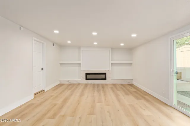 a view of a kitchen with a sink and a refrigerator